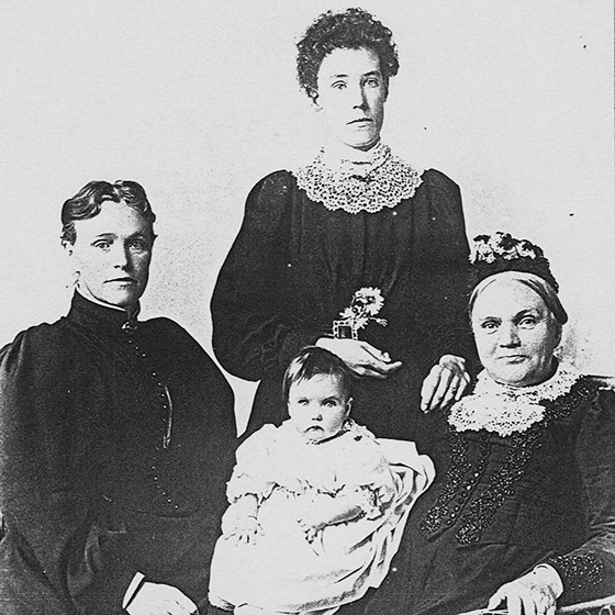 Black and white photo of four generations of women