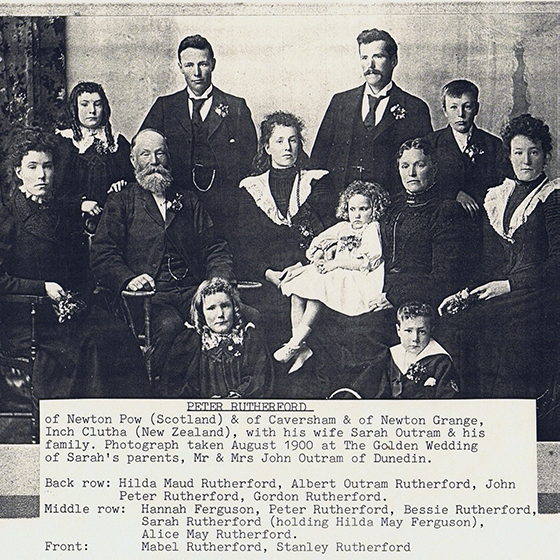 Black & white photo of Peter Rutherford, wife Sarah Outram, and ten children